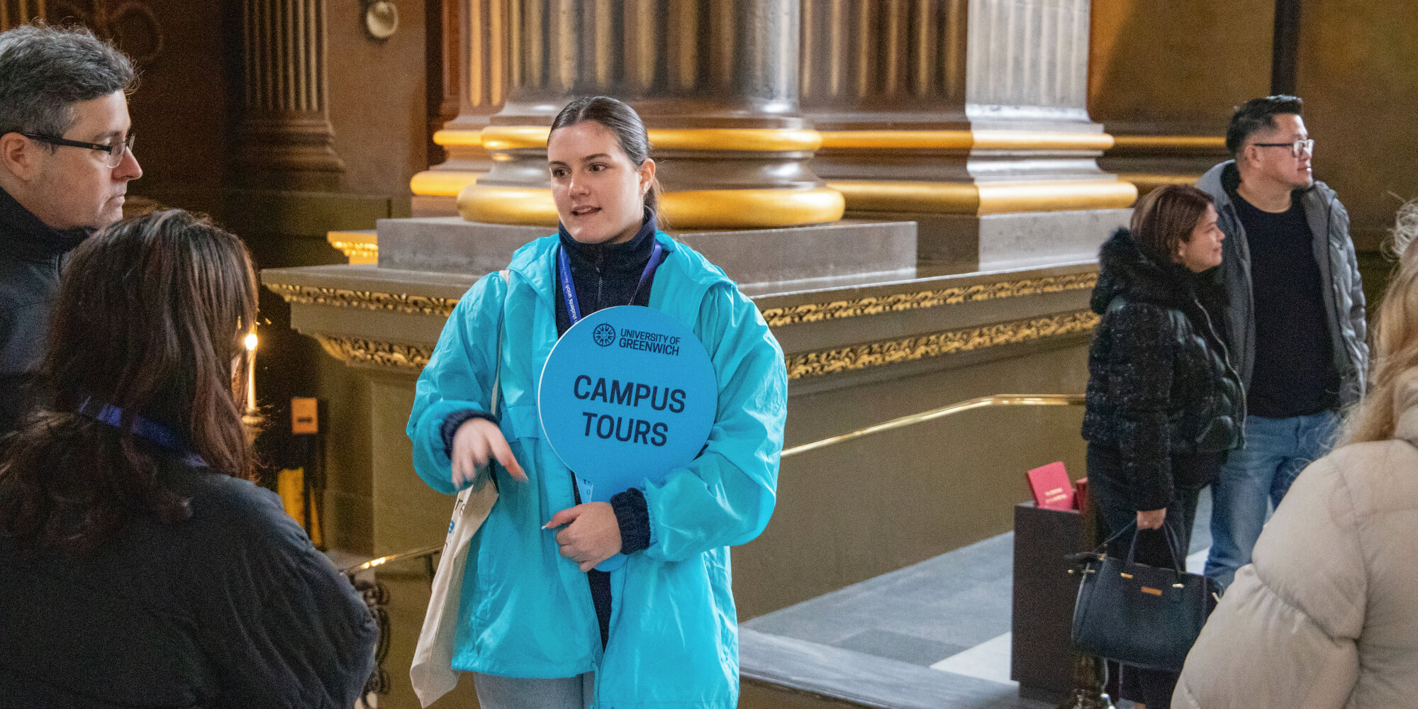 Image of a student ambassador giving a campus tour of the Greenwich campus on an Open Day. 